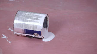 A spilled tin of paint 
